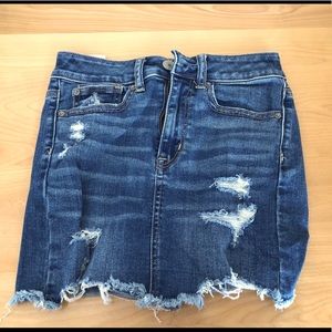 High waisted distressed denim skirt